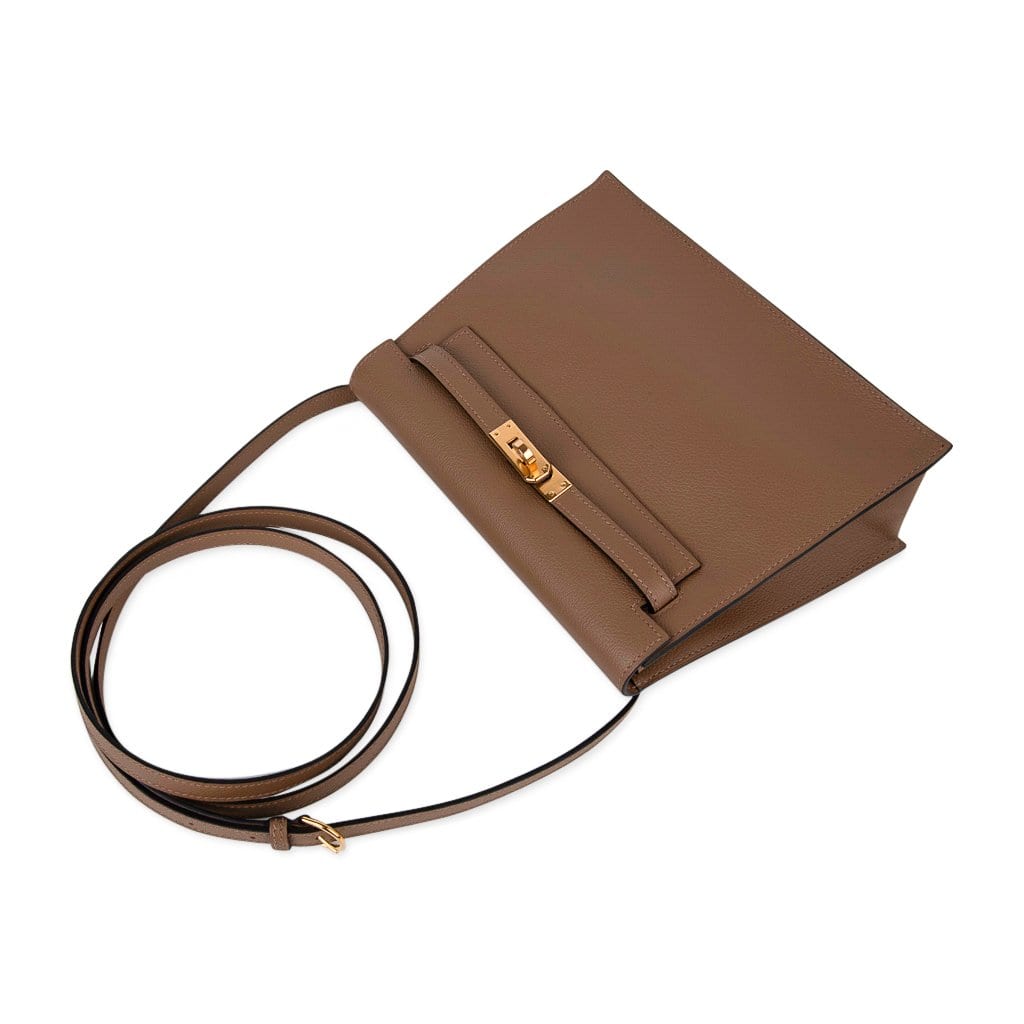 A GOLD EVERGRAIN LEATHER KELLY DANSE WITH GOLD HARDWARE, HERMÈS