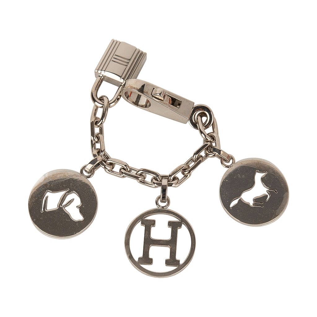 Hermes silver charm bracelet with charms that are from their iconic  collections